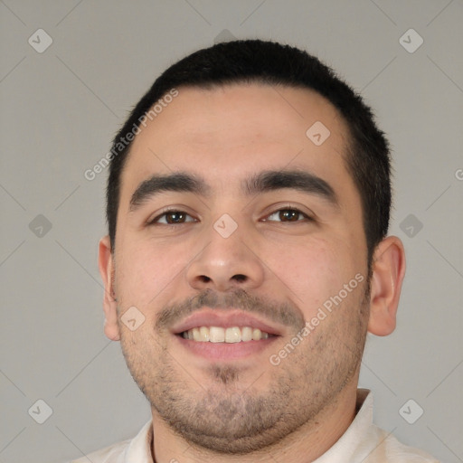 Joyful white young-adult male with short  black hair and brown eyes