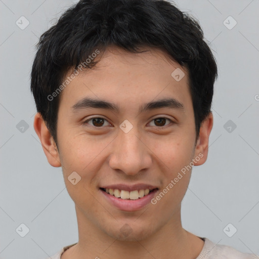 Joyful asian young-adult male with short  brown hair and brown eyes