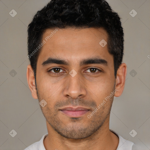 Joyful latino young-adult male with short  black hair and brown eyes