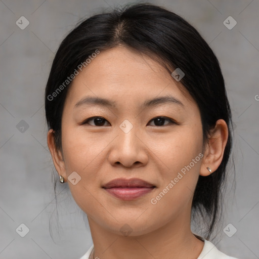 Joyful asian young-adult female with medium  brown hair and brown eyes