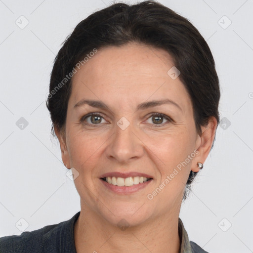 Joyful white adult female with short  brown hair and brown eyes