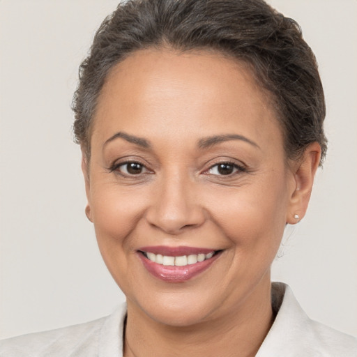 Joyful white adult female with short  brown hair and brown eyes