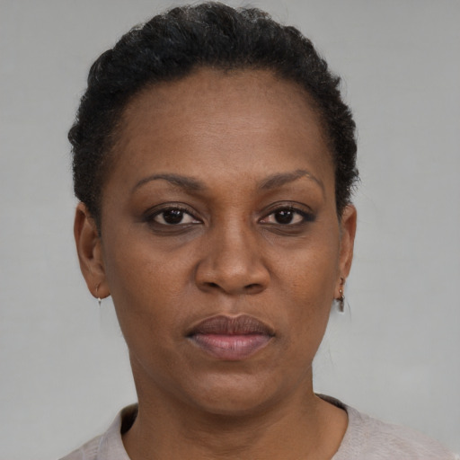 Neutral black adult female with short  brown hair and brown eyes