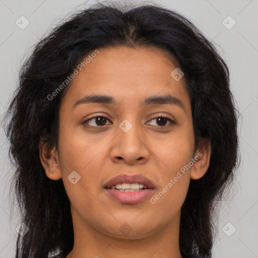 Joyful latino young-adult female with long  brown hair and brown eyes