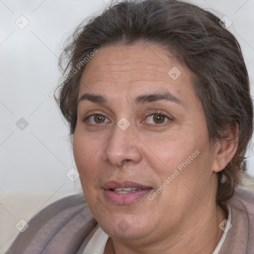 Joyful white adult female with short  brown hair and brown eyes