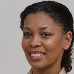 Joyful black young-adult female with medium  brown hair and brown eyes