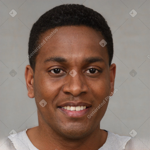 Joyful black young-adult male with short  brown hair and brown eyes