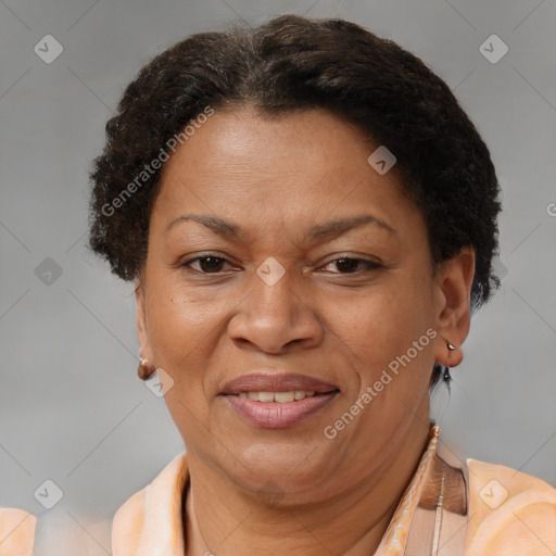 Joyful latino adult female with short  brown hair and brown eyes