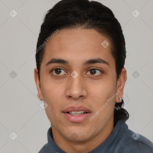 Joyful white young-adult male with short  black hair and brown eyes