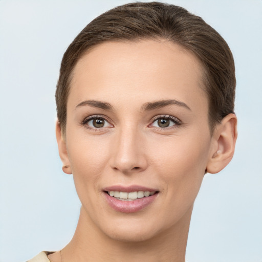 Joyful white young-adult female with short  brown hair and brown eyes