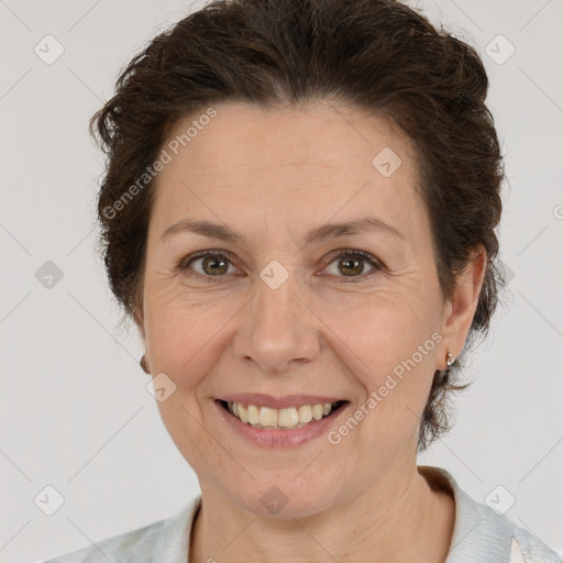 Joyful white adult female with short  brown hair and brown eyes