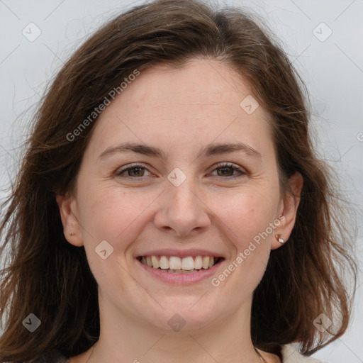 Joyful white adult female with medium  brown hair and grey eyes