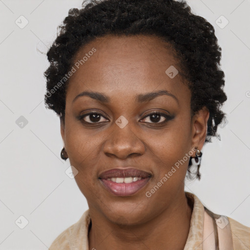 Joyful black young-adult female with long  brown hair and brown eyes