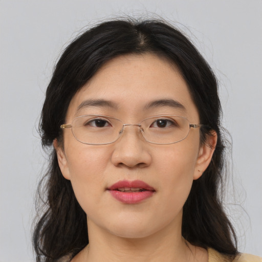 Joyful white adult female with long  brown hair and brown eyes