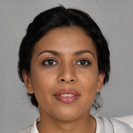 Joyful asian young-adult female with medium  brown hair and brown eyes