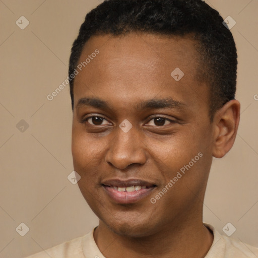 Joyful black young-adult male with short  brown hair and brown eyes