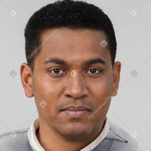 Joyful latino young-adult male with short  brown hair and brown eyes