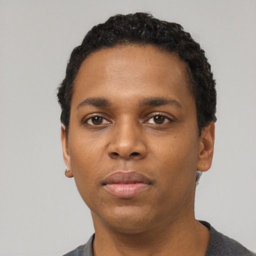 Neutral black young-adult male with short  black hair and brown eyes