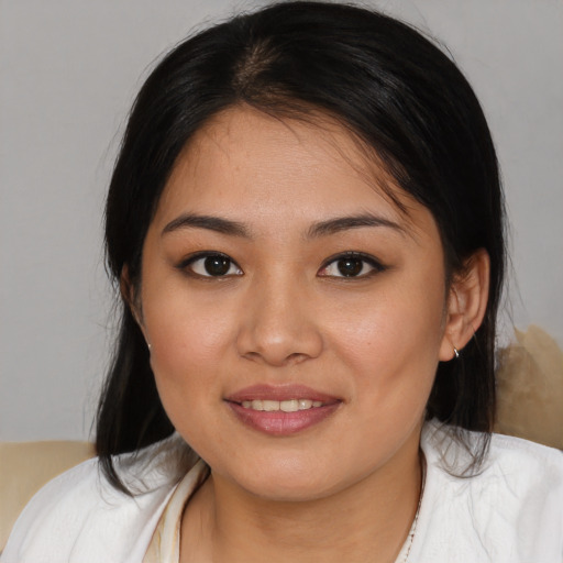 Joyful white young-adult female with medium  brown hair and brown eyes