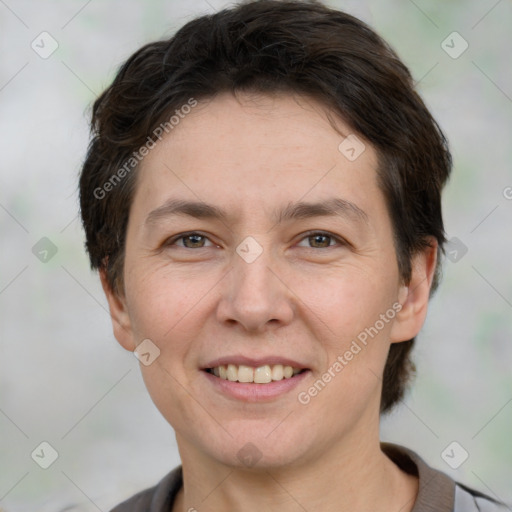 Joyful white adult female with short  brown hair and brown eyes