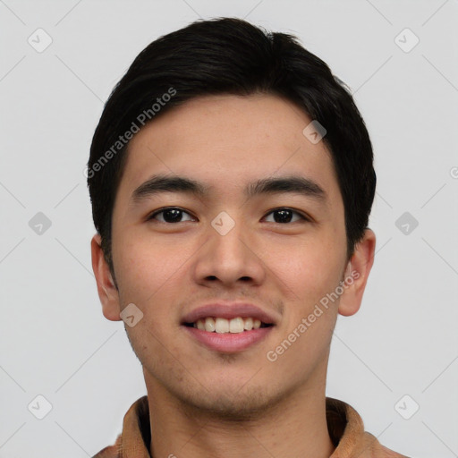 Joyful asian young-adult male with short  black hair and brown eyes