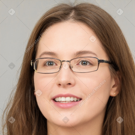 Joyful white young-adult female with long  brown hair and green eyes