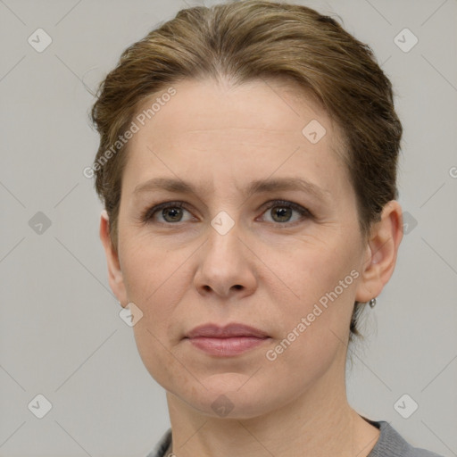 Joyful white adult female with short  brown hair and grey eyes