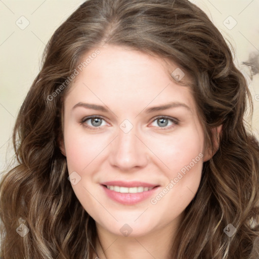 Joyful white young-adult female with long  brown hair and green eyes