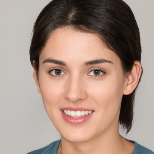 Joyful white young-adult female with medium  brown hair and brown eyes