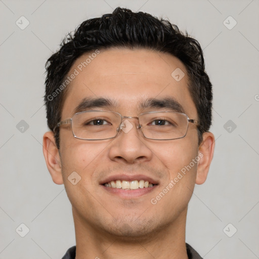 Joyful white young-adult male with short  black hair and brown eyes