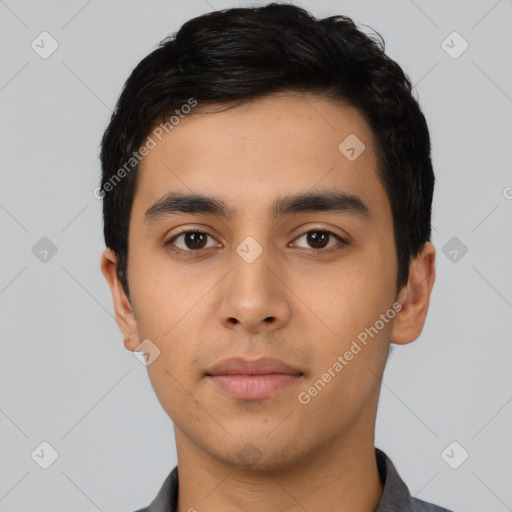 Neutral latino young-adult male with short  black hair and brown eyes