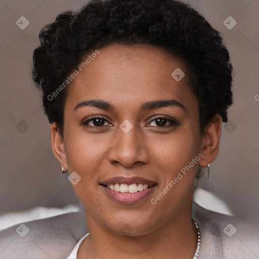 Joyful black young-adult female with short  brown hair and brown eyes