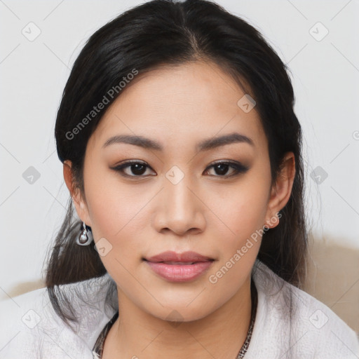 Joyful asian young-adult female with medium  black hair and brown eyes