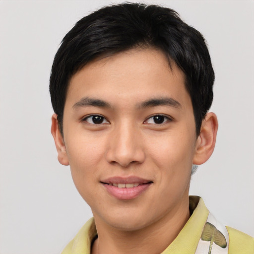 Joyful asian young-adult male with short  brown hair and brown eyes