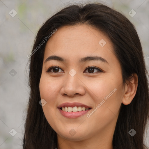 Joyful asian young-adult female with long  brown hair and brown eyes