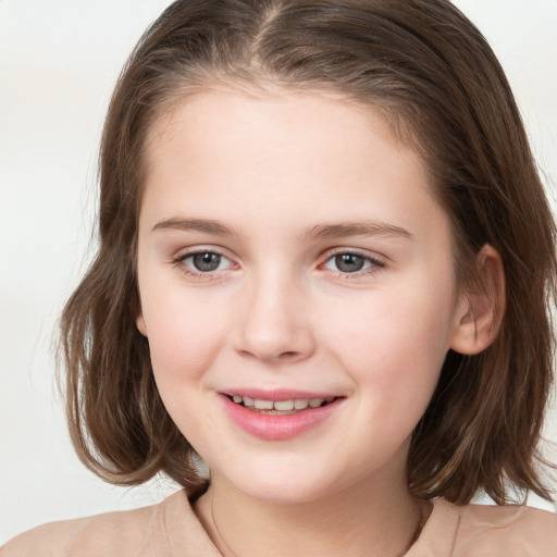 Joyful white child female with medium  brown hair and grey eyes