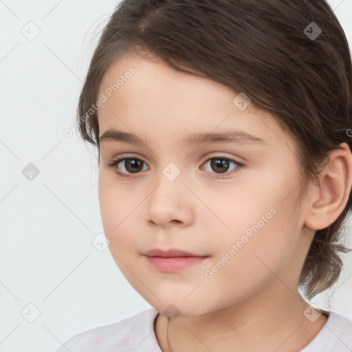 Joyful white child female with medium  brown hair and brown eyes