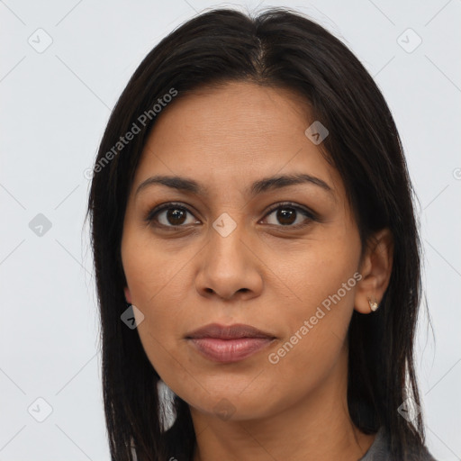 Joyful latino young-adult female with long  brown hair and brown eyes