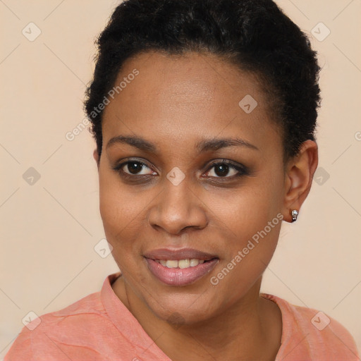 Joyful black young-adult female with short  brown hair and brown eyes