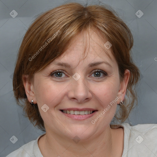 Joyful white adult female with medium  brown hair and grey eyes