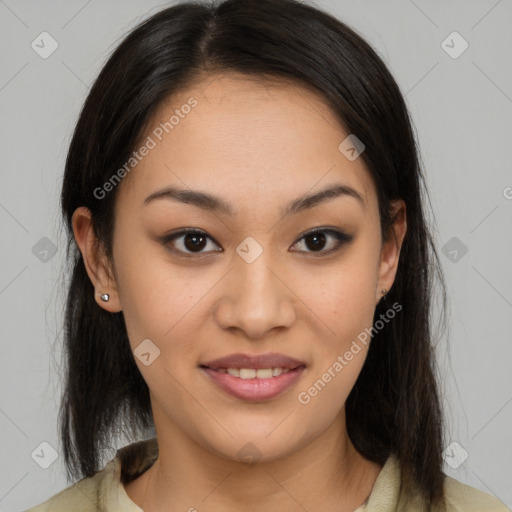 Joyful latino young-adult female with medium  brown hair and brown eyes