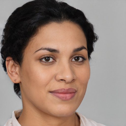 Joyful latino young-adult female with short  brown hair and brown eyes