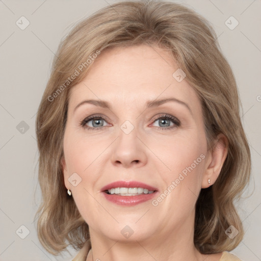 Joyful white adult female with medium  brown hair and grey eyes