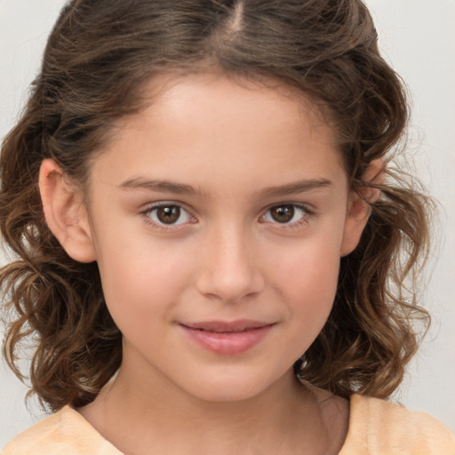 Joyful white child female with medium  brown hair and brown eyes