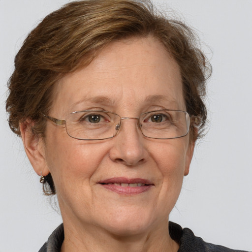 Joyful white middle-aged female with medium  brown hair and grey eyes