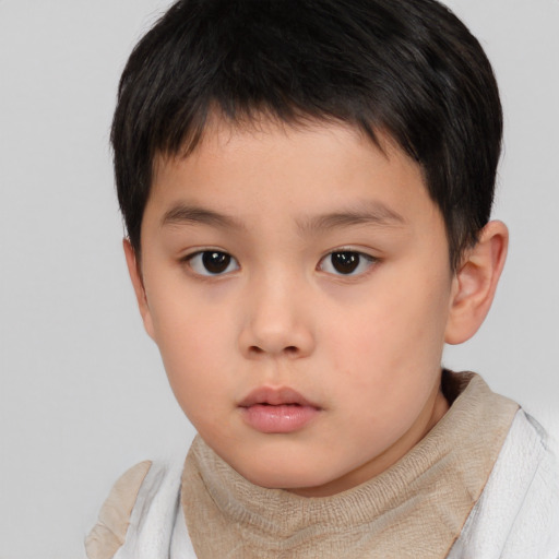 Neutral asian child male with short  brown hair and brown eyes