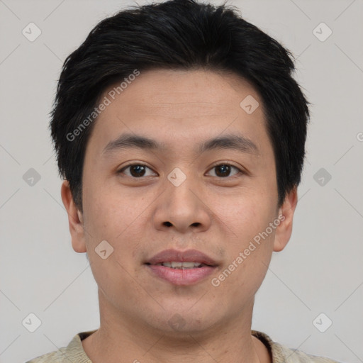 Joyful asian young-adult male with short  brown hair and brown eyes