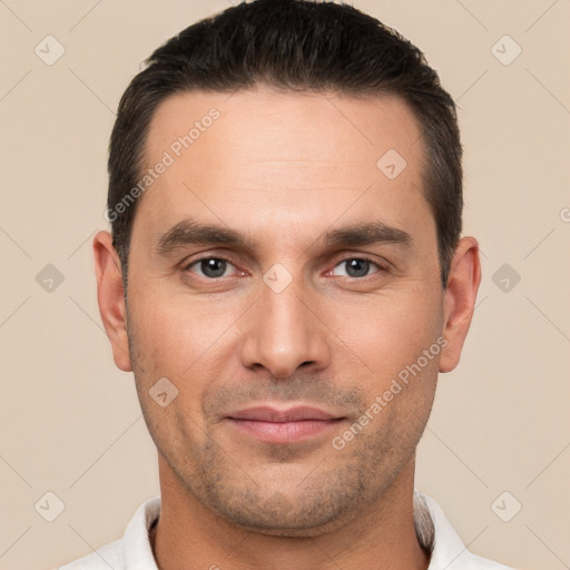 Joyful white young-adult male with short  brown hair and brown eyes