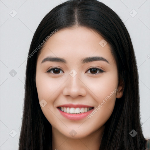 Joyful white young-adult female with long  black hair and brown eyes