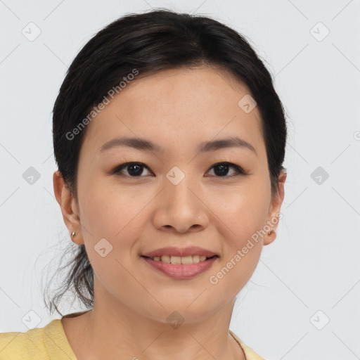 Joyful asian young-adult female with medium  brown hair and brown eyes